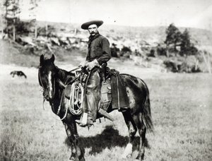 Cowboy reitet ein Pferd in Montana, USA, ca. 1880